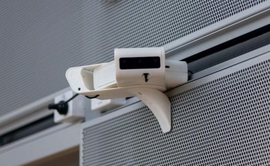 AI edge camera mounted on a building rail