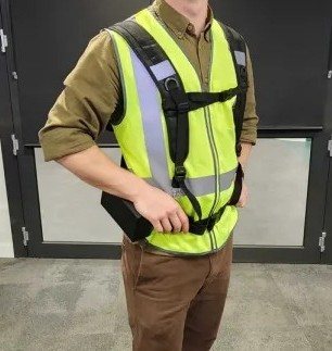 Front view of a team member wearing the posture-correction exoskeleton vest