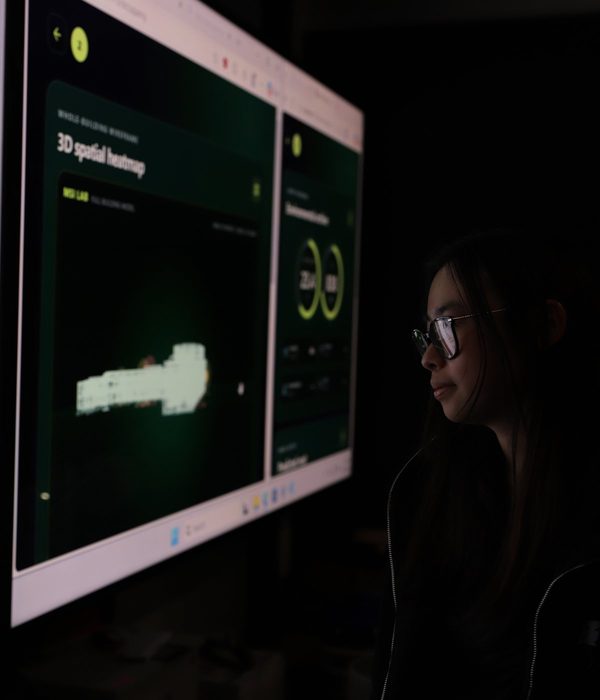A VISTA member lit by the 3D spatial heatmap and environmental dashboards in the MSI Lab